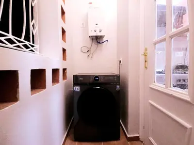 a hallway with a washing machine in a room at old a supprimer in Marrakech