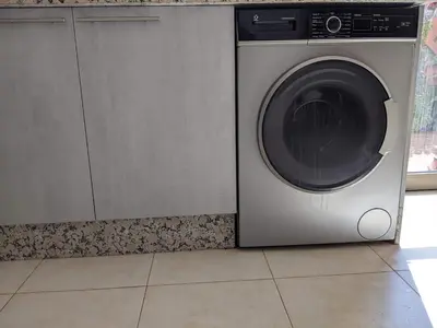 a washing machine is sitting in a kitchen at Janat House in Marrakech
