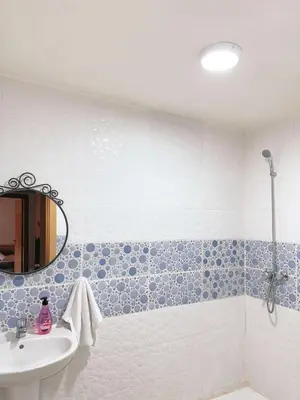a bathroom with a sink and a mirror at Appartement Xénon in Marrakech