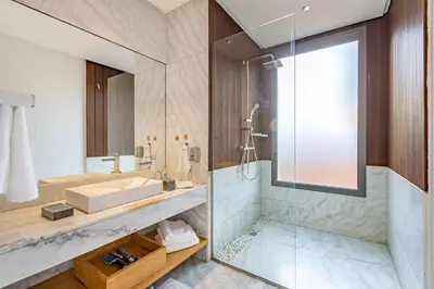 a bathroom with a tub and a sink and a shower at New! Appt de Luxe à Oliver Palm, Piscine Privé in Marrakech
