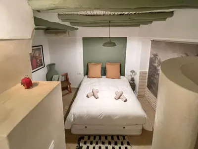 a bedroom with a bed with two teddy bears on it at Riad Dardeco privé centre Medina Marrakech in Marrakech