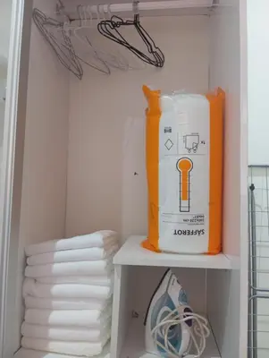 a room with a shelf with a bag of towels at Palace appart Marrakech - hivernage in Marrakech