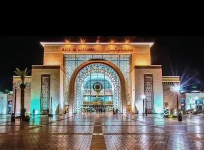 a large building with a lit up facade at night at Appartement à Gueliz près de toute commodité in Marrakech