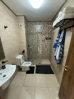 a bathroom with a toilet and a sink at Appartement au centre de gueliz in Marrakech
