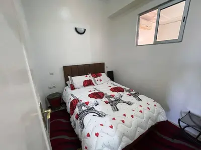 a bedroom with a bed with red hearts on it at appartement au coeur de marrakech proche de tout in Marrakech