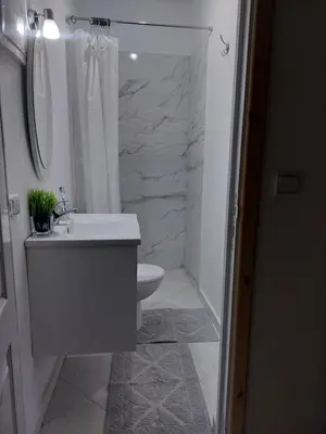 a bathroom with a sink and a toilet and a shower at Marrakech in Marrakech