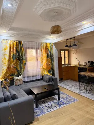 a living room with a couch and a table at Julie Airport Marrakech Apartments in Marrakech