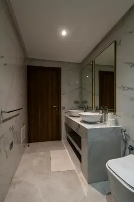 a bathroom with two sinks and a large mirror at Menara Garden duplex 3 suites in Marrakech