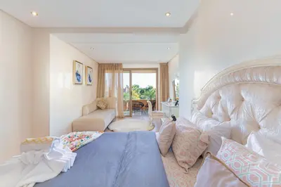 a bedroom with a bed and a living room at 2 Bedrooms Equipped apart in Marrakech