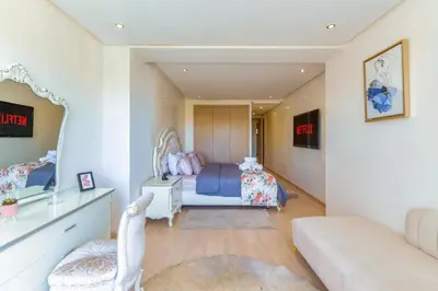 a bedroom with a bed and a couch at 2 Bedrooms Equipped apart in Marrakech