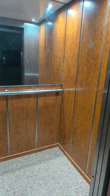 a closet with wooden doors in a room at Appartement Piscine à Marrakech in Marrakech