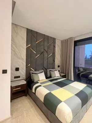 a bedroom with a large bed in a room at Villa familiale avec piscine chauffée La Dolce Vita in Marrakech