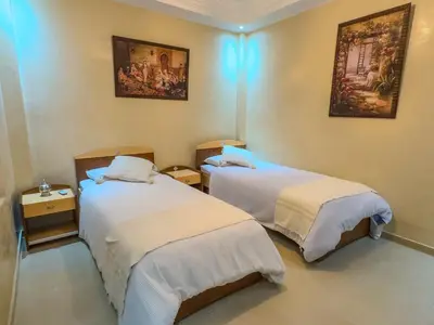 a room with two beds in a room at Rare ! duplex avec vue sur les toits de Marrakech in Marrakech