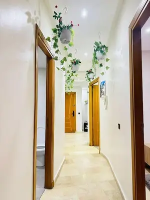 a hallway with a toilet and flowers on the ceiling at Cosy House Marrakech Semlalia - Gueliz Center in Marrakech