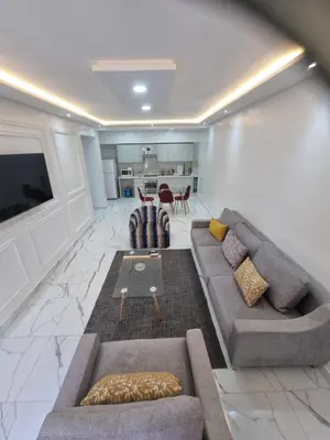 a living room with a couch and a table at Kech vacations FRIENDLY! 2 bedroom luxury apartment in Marrakech