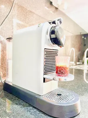 a toaster sitting on a counter with a glass at Riad Garden Luxury Aparts by SABOR VOYAGE in Marrakech