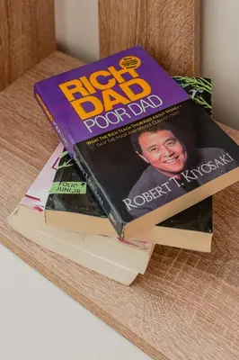 a stack of books sitting on a table at Appartement de prestige au golf in Marrakech