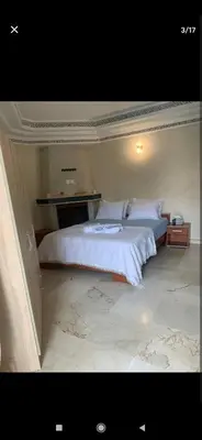 a bedroom with a large bed in a room at Marrakesh in Marrakech