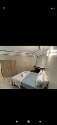 a small bedroom with a bed and a desk at Marrakesh in Marrakech