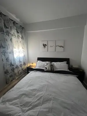 a bedroom with a large bed and a window at Portes de Marrakech in Marrakech