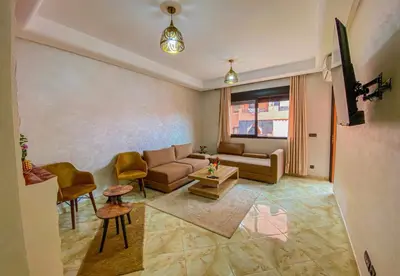 a living room with a couch and a table at Hamza Immobiler in Marrakech