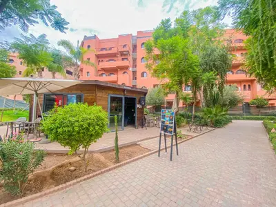 a building with a sign in front of it at Hamza Immobiler in Marrakech