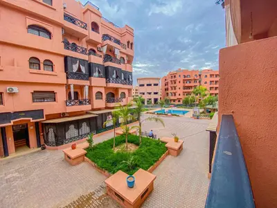 an aerial view of a building with a courtyard with benches at Hamza Immobiler in Marrakech