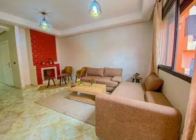 a living room with a couch and a table at Hamza Immobiler in Marrakech