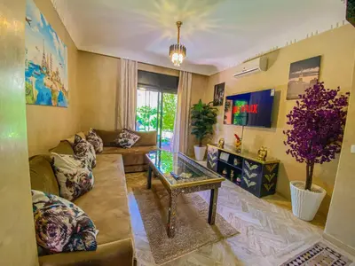 a living room with a couch and a table at Hamza immobiler in Marrakech