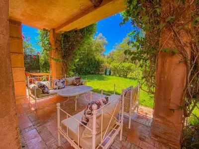 an outdoor patio with a couch and a table at Hamza immobiler in Marrakech