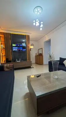 a living room with a couch and a coffee table at Marrakech menara in Marrakech