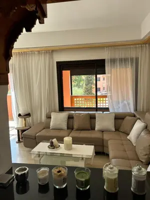 a living room with a couch and a table at Marrakech Residence in Marrakech