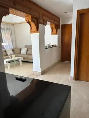 a living room with a couch and a table at Marrakech Residence in Marrakech