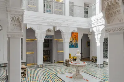 a large room with a fountain in the middle of a building at Boutique Hotel La Maison dArts et Medicine in Marrakech