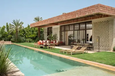 a villa with a swimming pool and a patio at Villa Saman in Marrakech