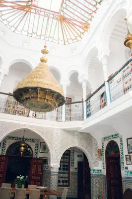 a large room with a chandelier in a building at Boutique Hotel Riad Almoulouk in Marrakech