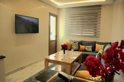 a living room with a couch and a table at The Elite suites in Marrakech