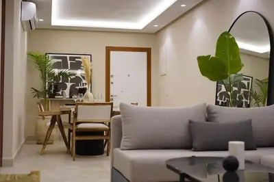 a living room with a couch and a table at Beldi Chic apartment in Marrakech in Marrakech