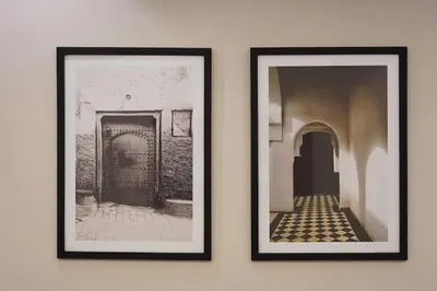 two framed photographs hanging on a wall at Beldi Chic apartment in Marrakech in Marrakech