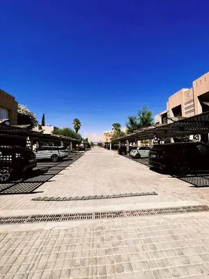 a street with cars parked in a parking lot at Casa Lina in Marrakech