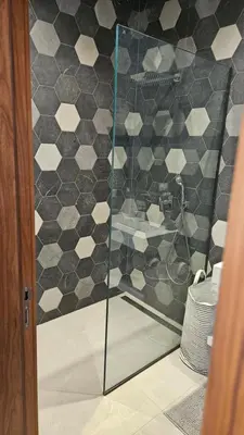 a shower with a glass door in a bathroom at Villa Dar Maryam in Marrakech