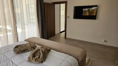 a bedroom with a bed with two pillows on it at Villa Dar Maryam in Marrakech