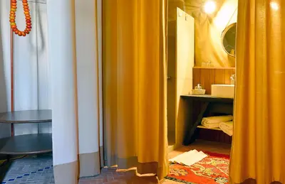 an open door to a room with yellow curtains at Riad Maialou & SPA in Marrakech
