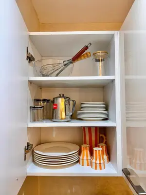 a kitchen pantry with plates and utensils at Pearl Garden Studio Cosy Lux Elegant Sunny Terrace Piscine in Marrakech