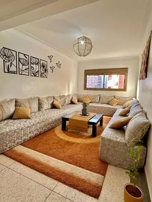 a living room with a couch and a coffee table at Taha house in Marrakech