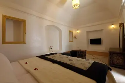 a bedroom with a large bed in a room at Riad Haloma 90m2 in der Medina mit Terrasse in Marrakech