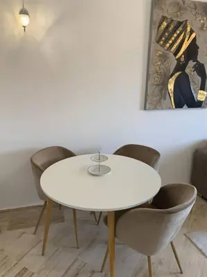 a white table and chairs in a room at Luxury Appartement with Pool in Marrakech