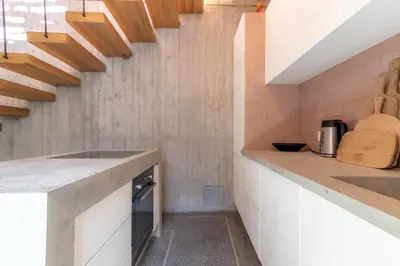 a kitchen with white counters and wooden ceilings at Riad Doum Collection 2 in Marrakech