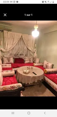 a room with a table and two couches and a table and a couch at Marrakech in Marrakech