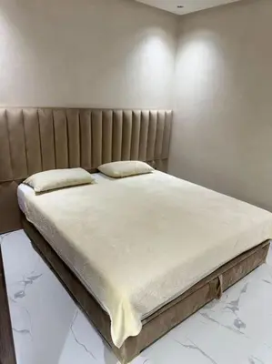 a bed with two pillows on it in a room at Appartement Cosy in Marrakech